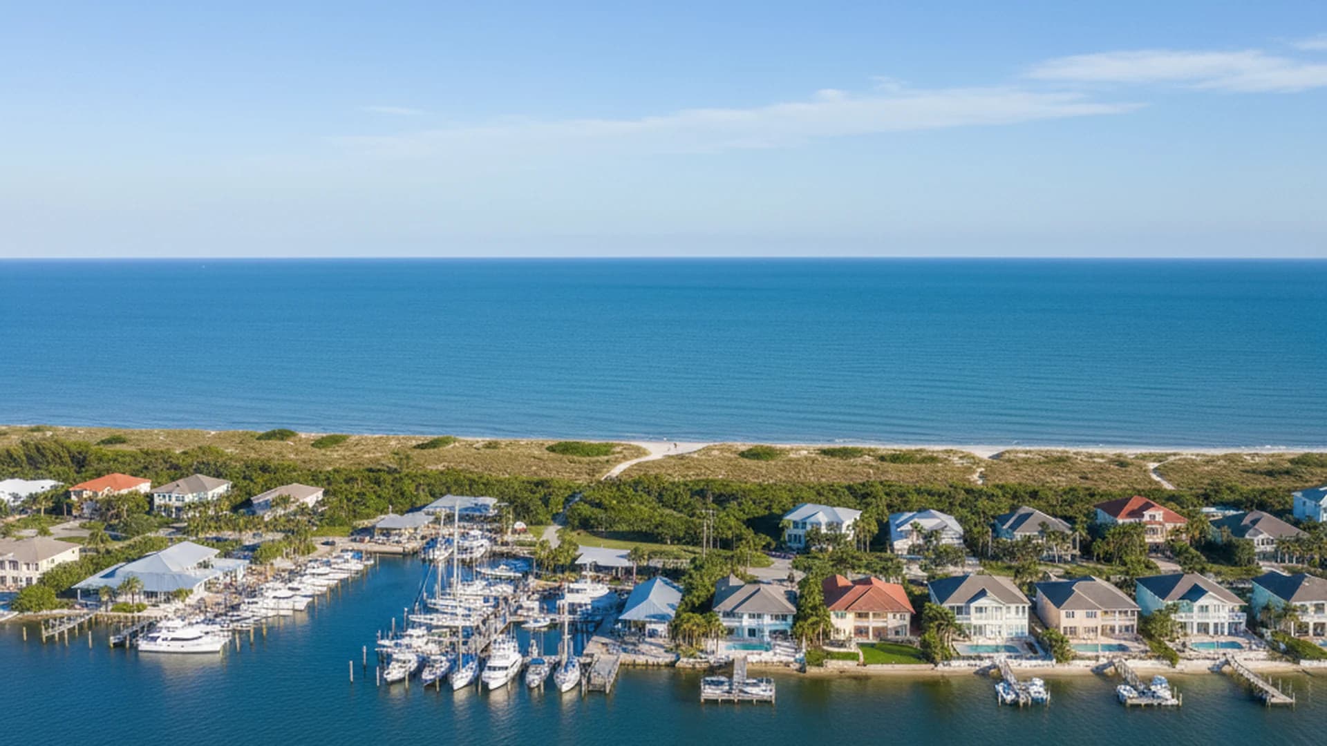Florida Treasure Coast aerial view showing barrier-island homes, Atlantic coast, and Indian River Lagoon